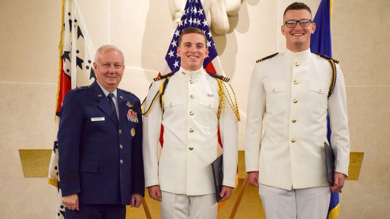 Commandant of Cadets Maj Gen Randal Fullhart with two graduating cadets.