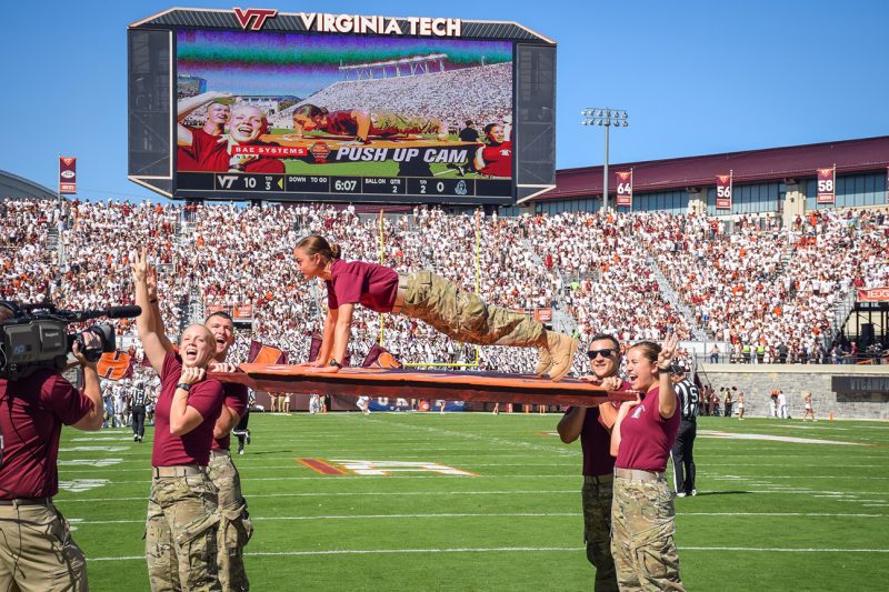 Cadets in Esprit de Corps do pushups to celebrate a touchdown in Lane Stadium.